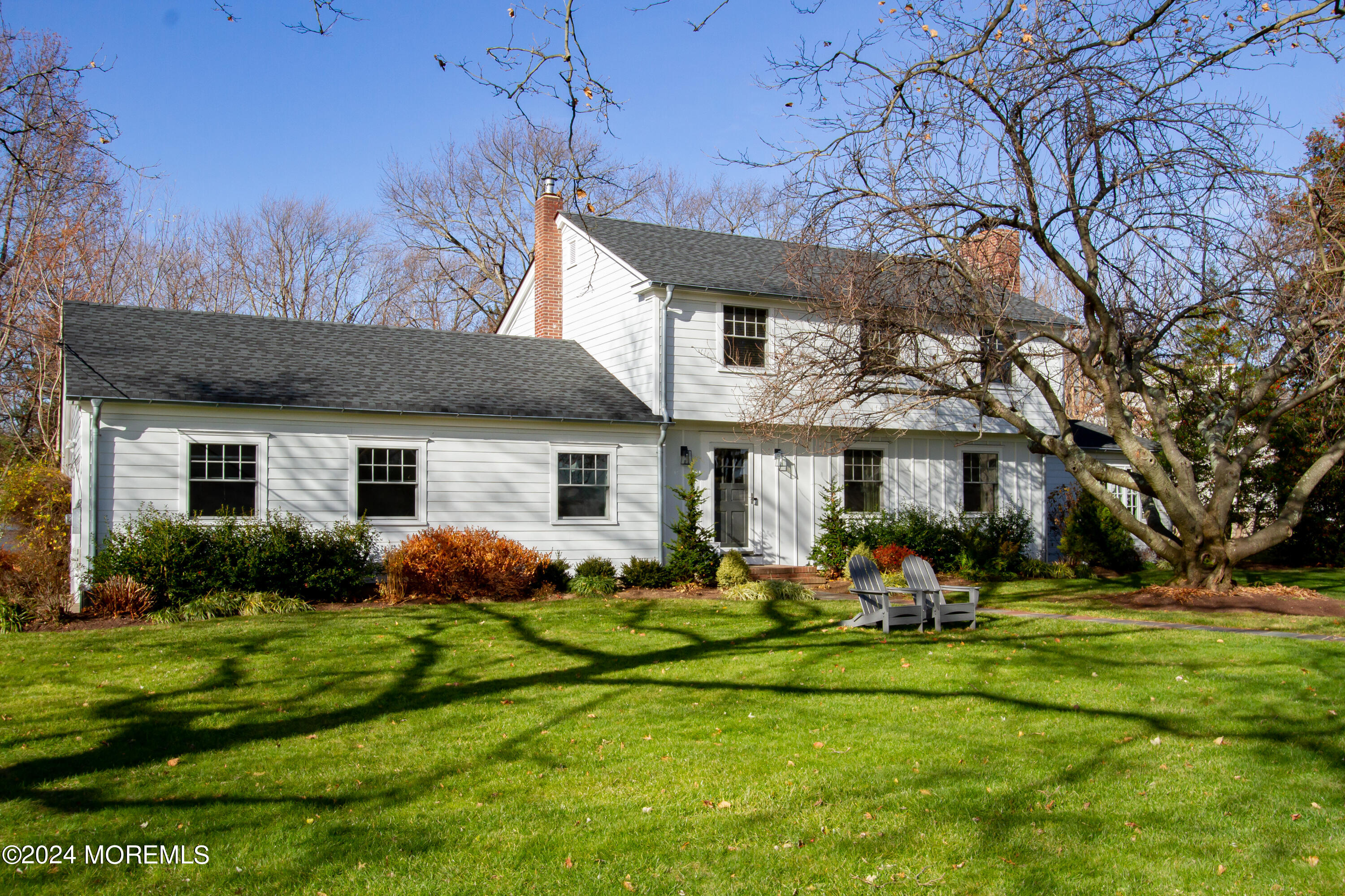 67 Rivers Edge Drive Little Silver, NJ 07739 - Photo 3 of 40 a front view of a house with a yard and trees