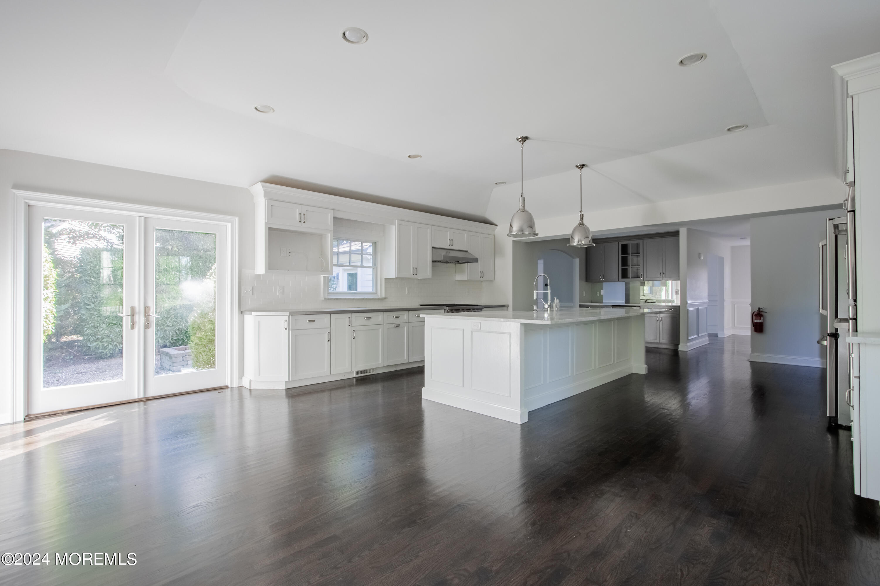 67 Rivers Edge Drive Little Silver, NJ 07739 - Photo 8 of 40 a view of kitchen with kitchen island wooden floor and refrigerator