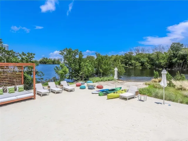a view of backyard with a table and chairs