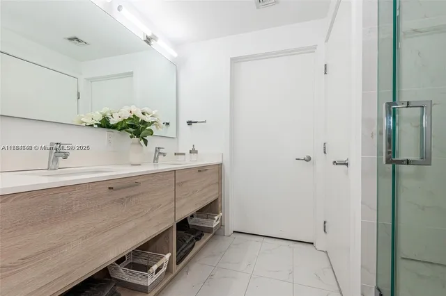 a bathroom with a sink and a mirror