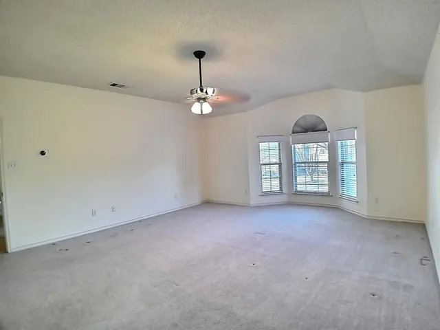 an empty room with a chandelier