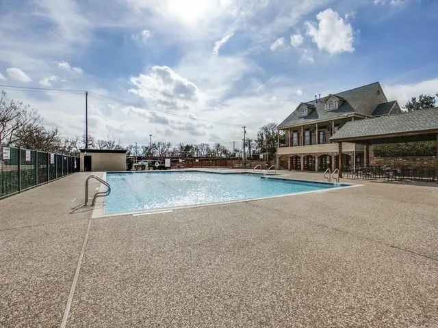 a view of a lake with a house in the background