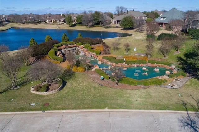 an aerial view of a house with outdoor space