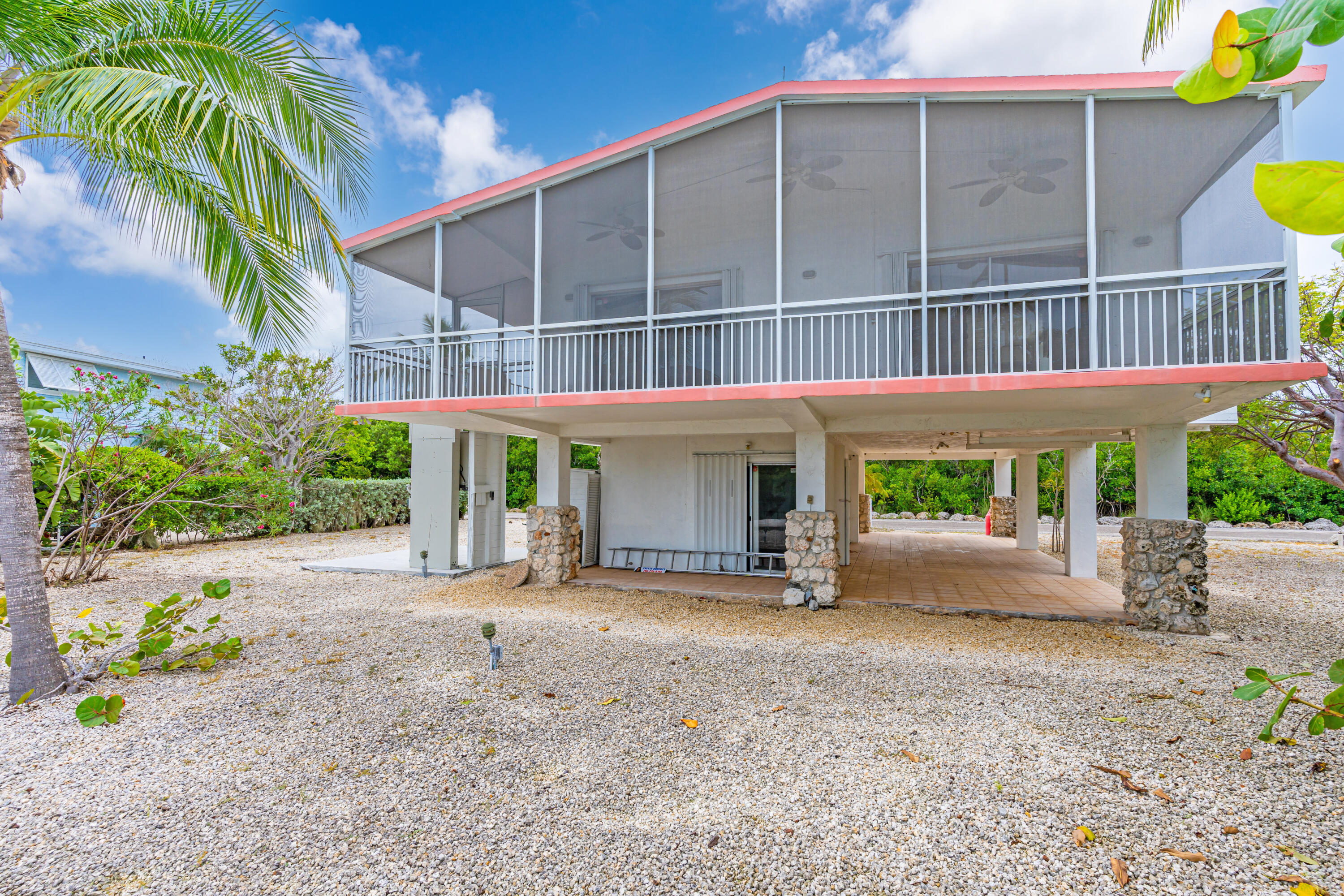 1502 Shaw Drive Key Largo, FL 33037 - Photo 16 of 42 a view of a house with a yard and sitting area