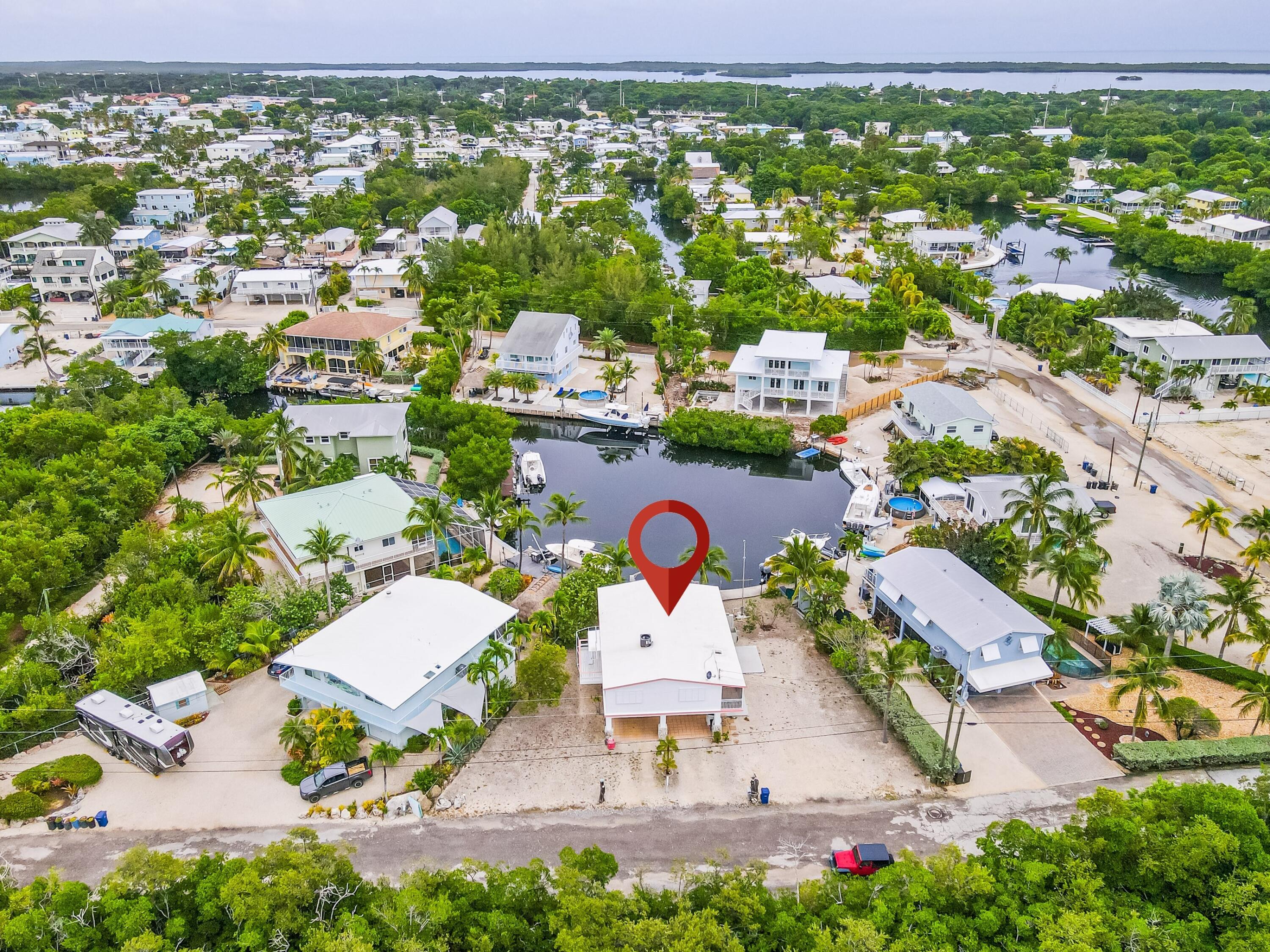 1502 Shaw Drive Key Largo, FL 33037 - Photo 19 of 42 an aerial view of residential houses with outdoor space and parking