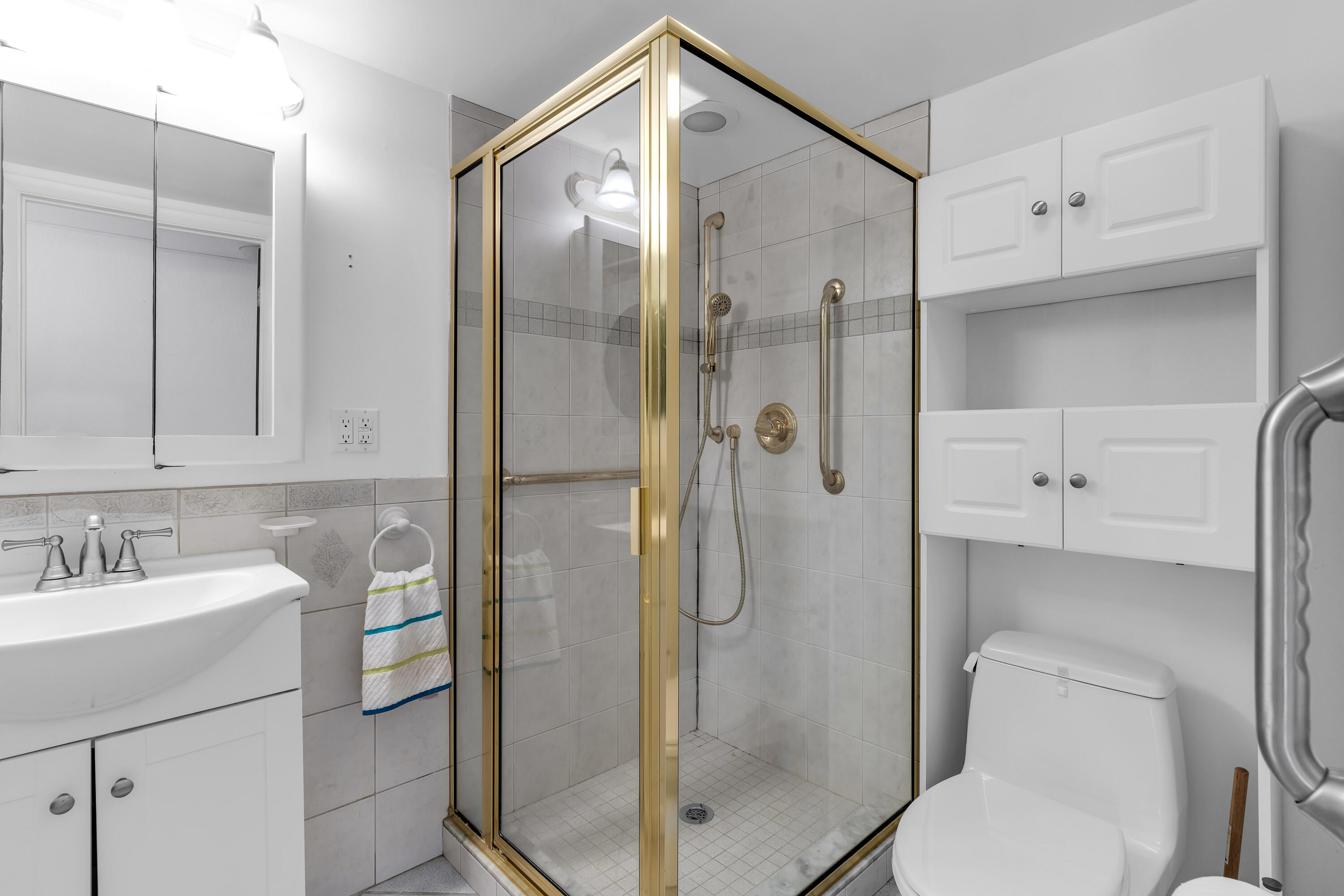 1502 Shaw Drive Key Largo, FL 33037 - Photo 25 of 42 a bathroom with a shower sink vanity and toilet