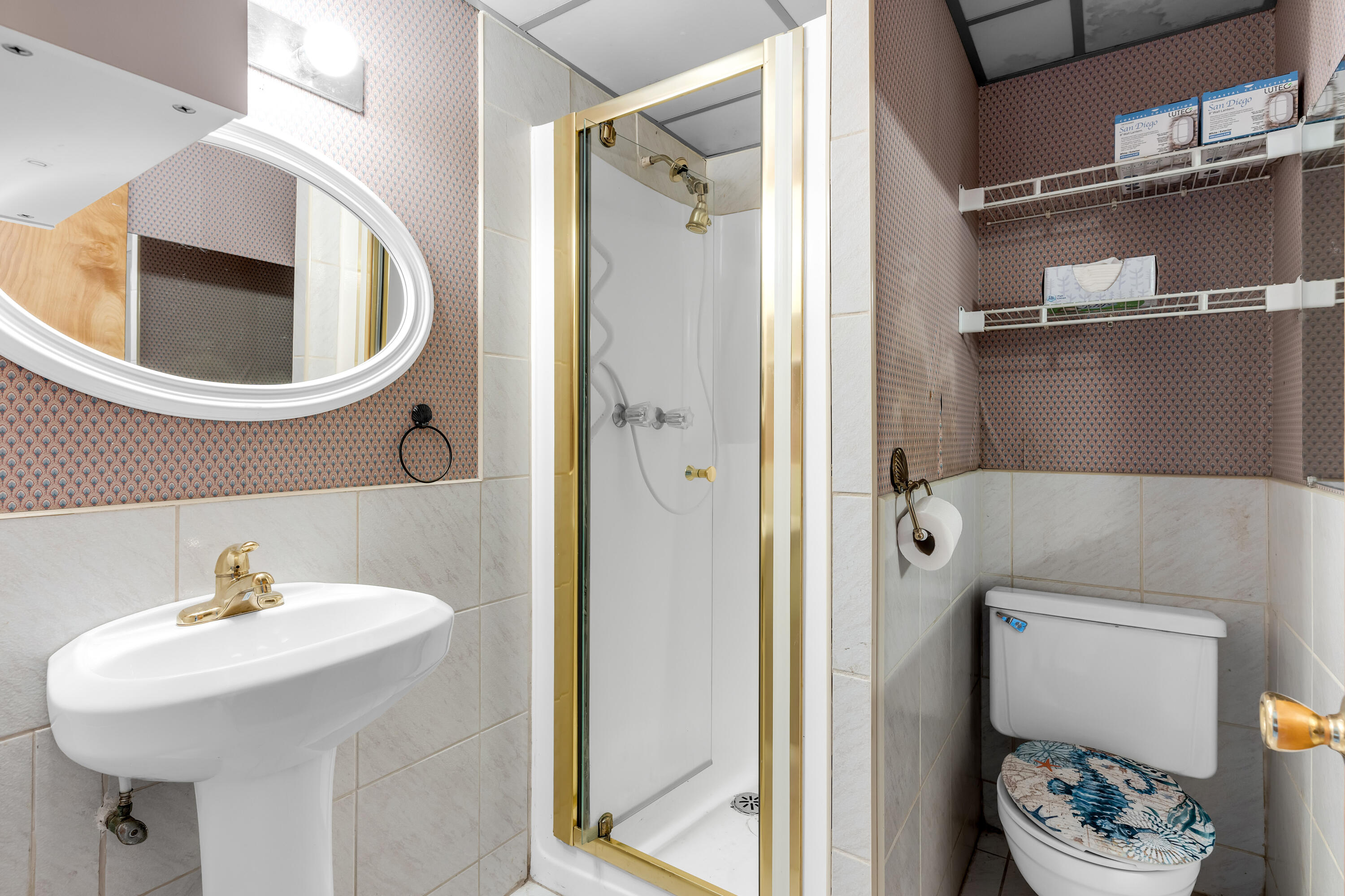 1502 Shaw Drive Key Largo, FL 33037 - Photo 30 of 42 a bathroom with a sink a toilet and a mirror