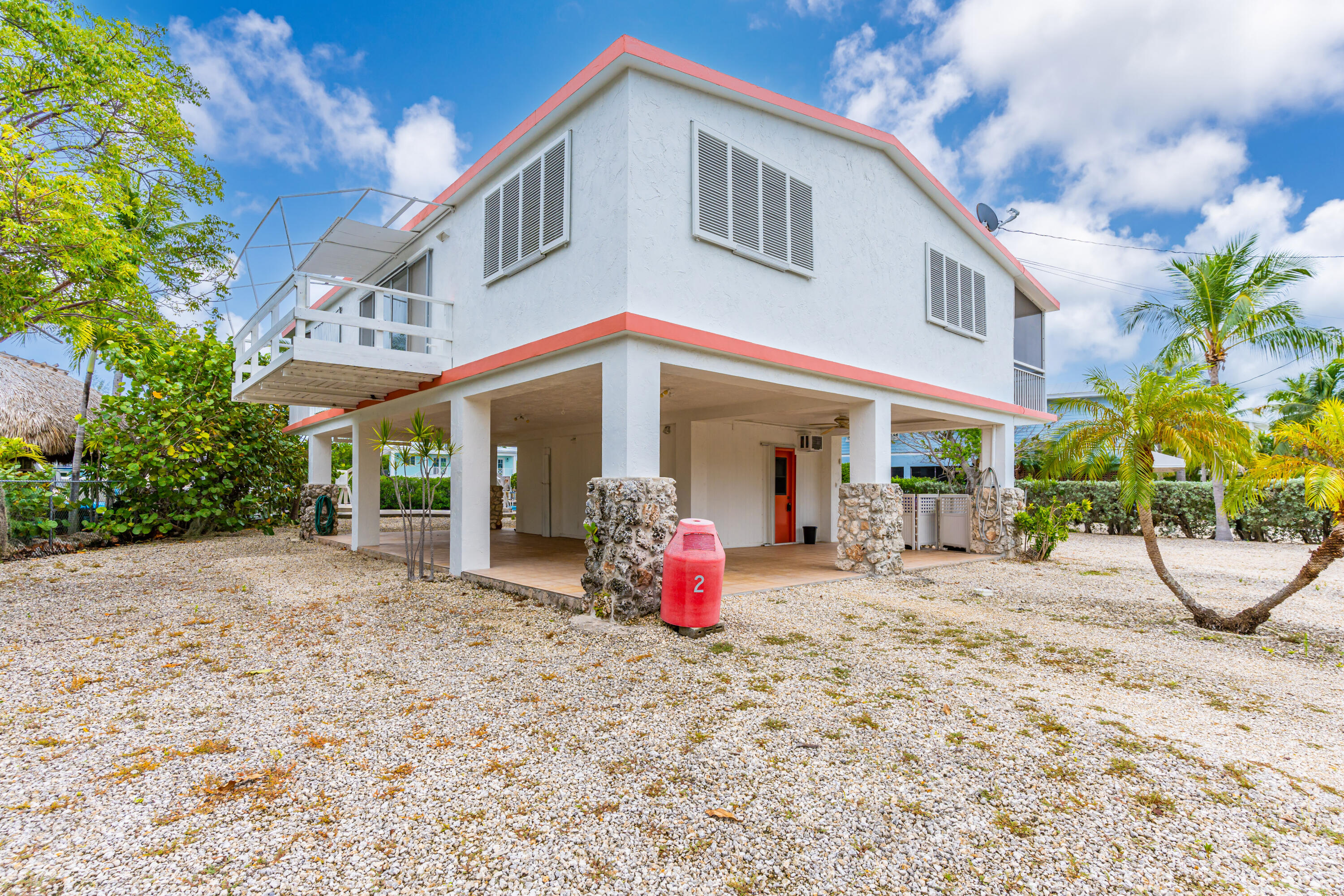 1502 Shaw Drive Key Largo, FL 33037 - Photo 31 of 42 a view of a house with backyard and sitting area