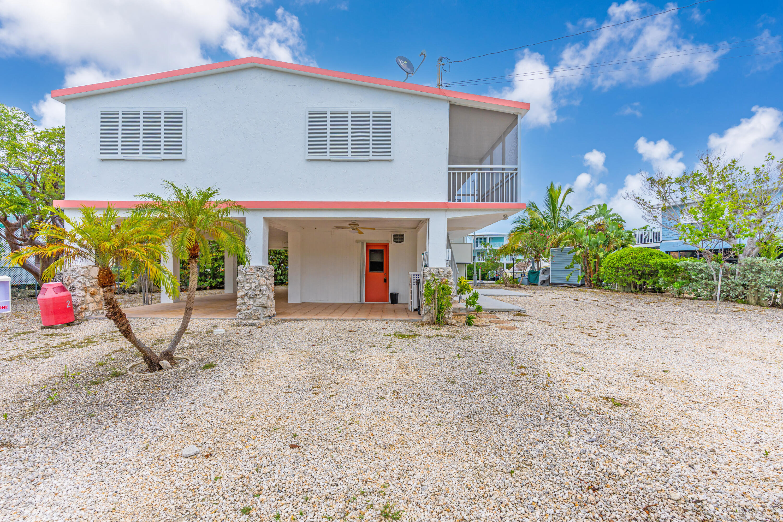 1502 Shaw Drive Key Largo, FL 33037 - Photo 32 of 42 a view of a house with potted plants