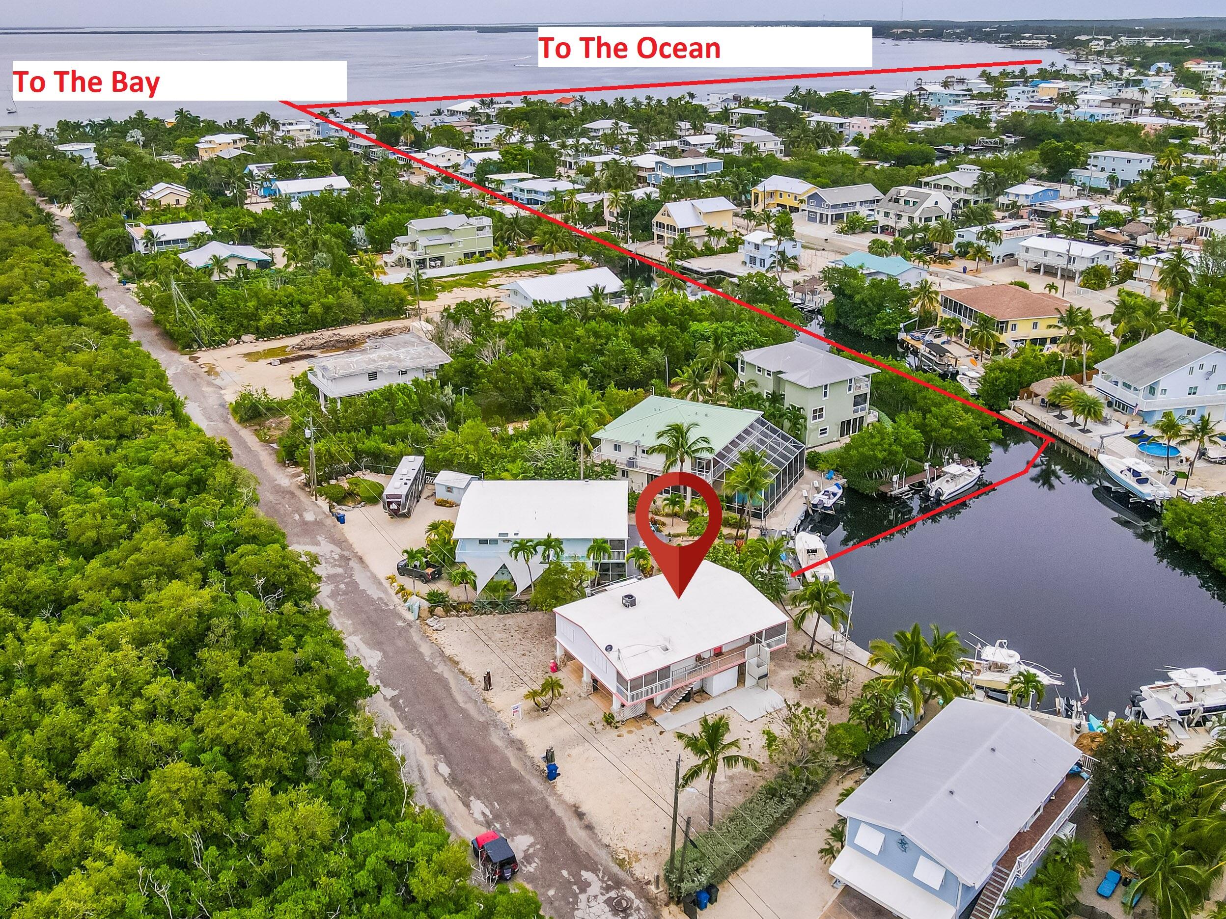 1502 Shaw Drive Key Largo, FL 33037 - Photo 10 of 42 an aerial view of residential houses with outdoor space