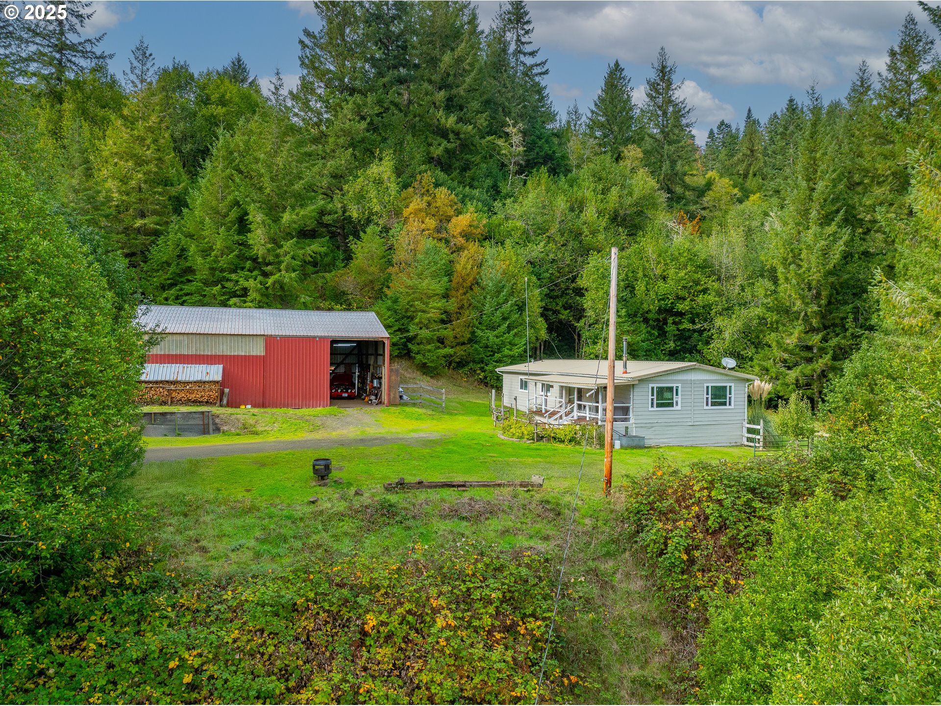98785 Sitkum Lane Myrtle Point, OR 97458 - Photo 1 of 45 a garden view with a seating space