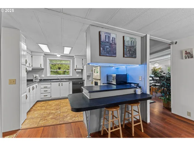 a kitchen with a table and chairs