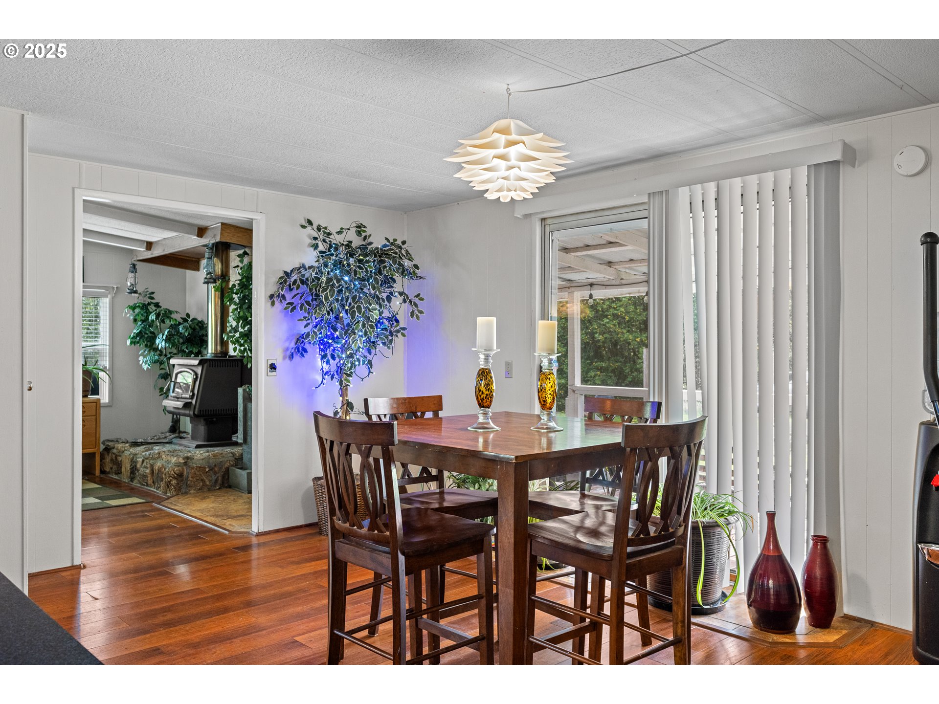 98785 Sitkum Lane Myrtle Point, OR 97458 - Photo 16 of 45 a view of a dining room with furniture window and wooden floor