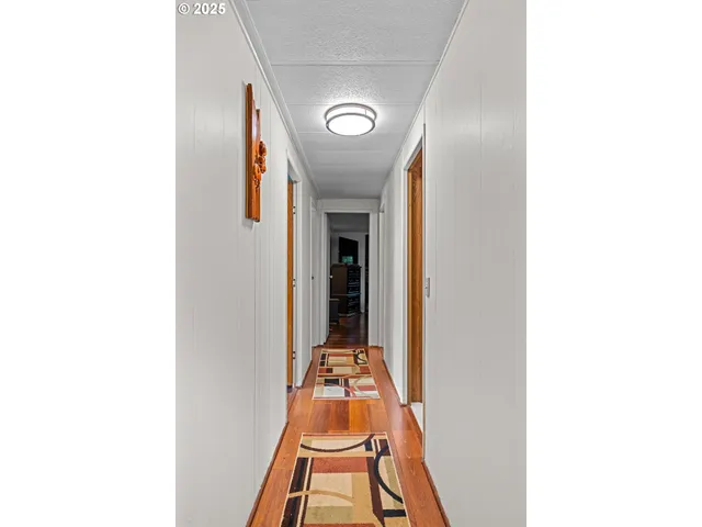 a hallway with front door and stairs