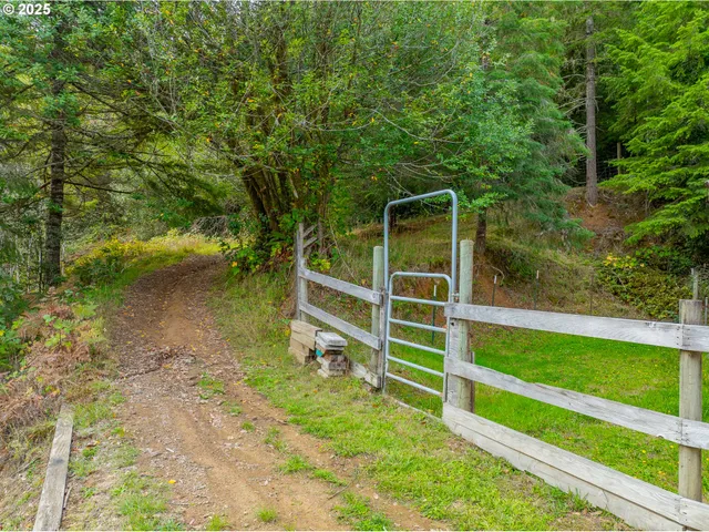 a view of a lush green hillside and houses