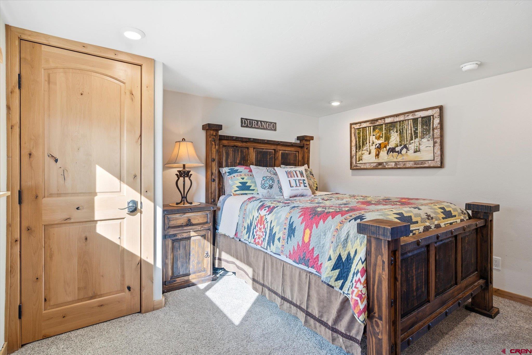 43681 Highway 550 Durango, CO 81301 - Photo 13 of 37 a bed sitting in a bedroom next to a window