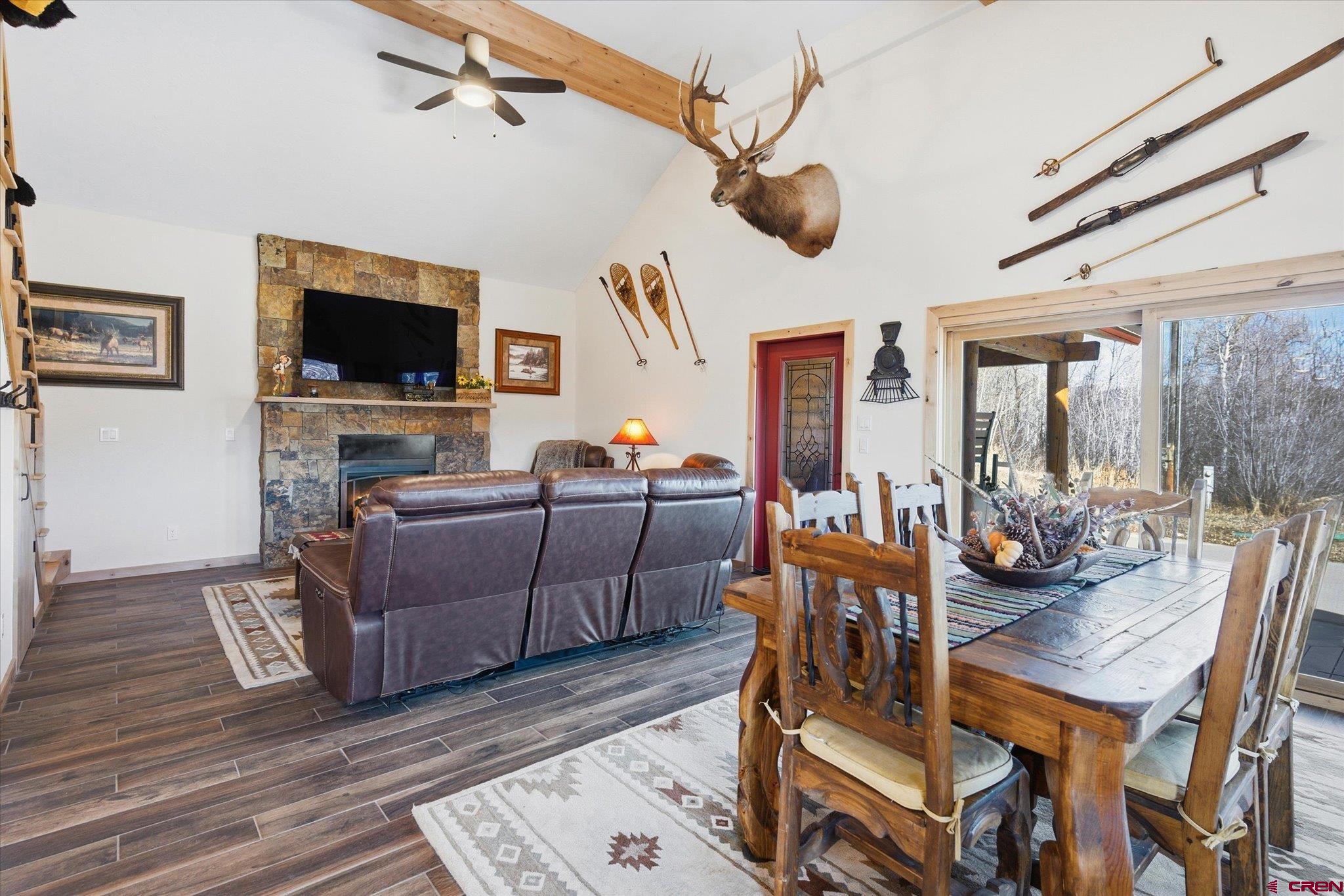 43681 Highway 550 Durango, CO 81301 - Photo 6 of 37 a living room with furniture and a flat screen tv