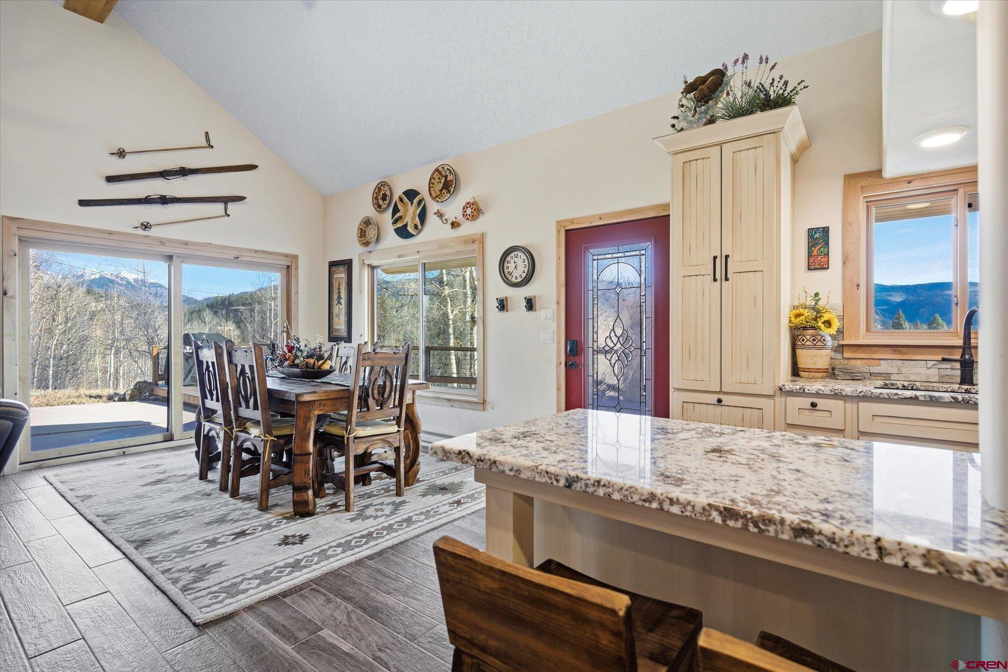 43681 Highway 550 Durango, CO 81301 - Photo 8 of 37 a dining hall with stainless steel appliances granite countertop a dining table and chairs with wooden floor
