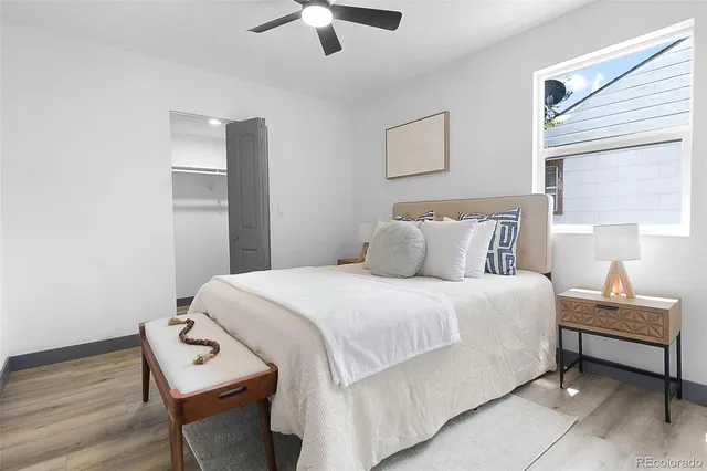 a bedroom with a bed and a chair