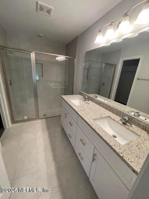 7426 Bowden Road Jacksonville, FL 32216 - Photo 18 of 23 a bathroom with a granite countertop sink and a mirror