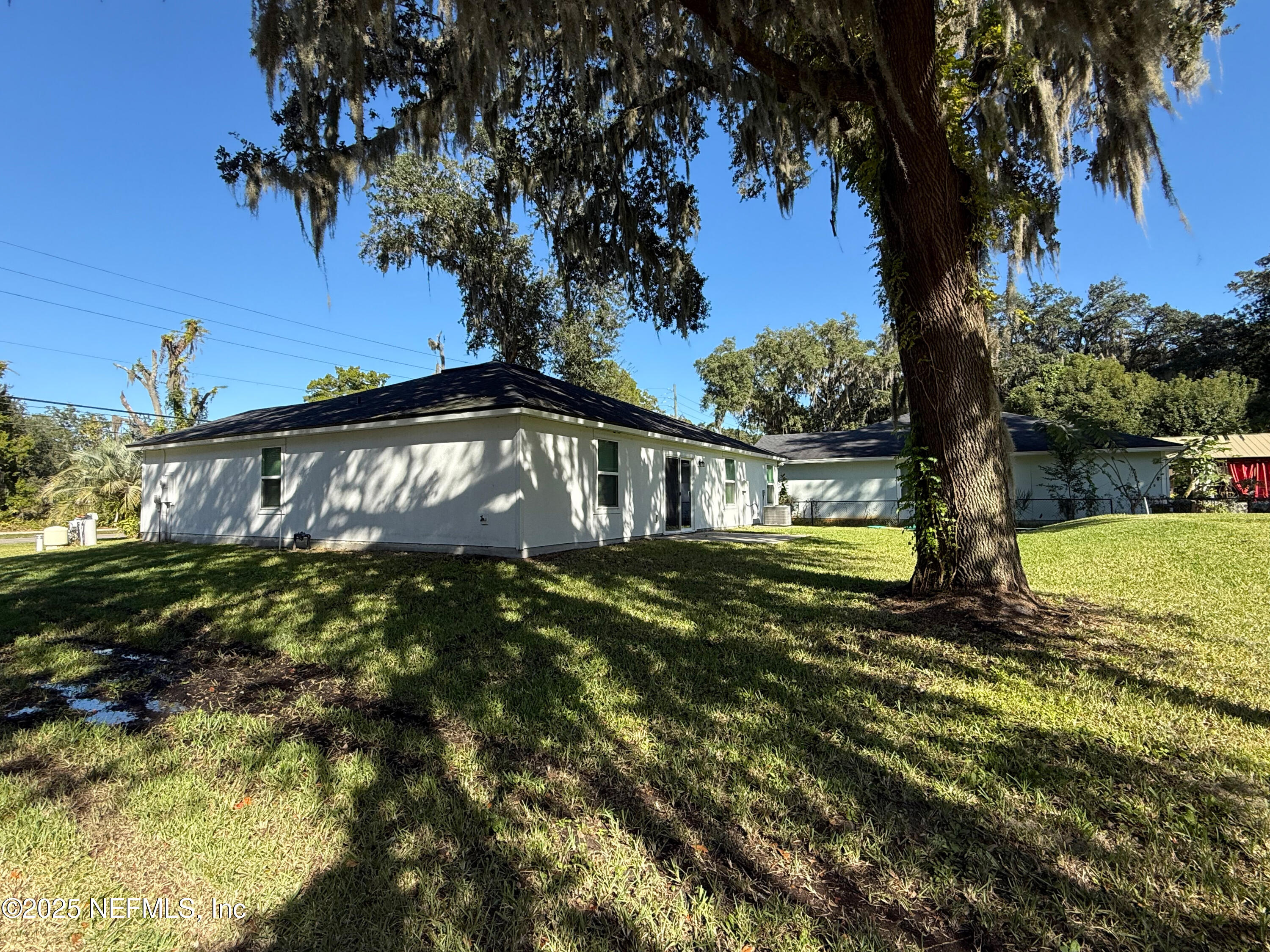 7426 Bowden Road Jacksonville, FL 32216 - Photo 21 of 23 a view of a house with a yard
