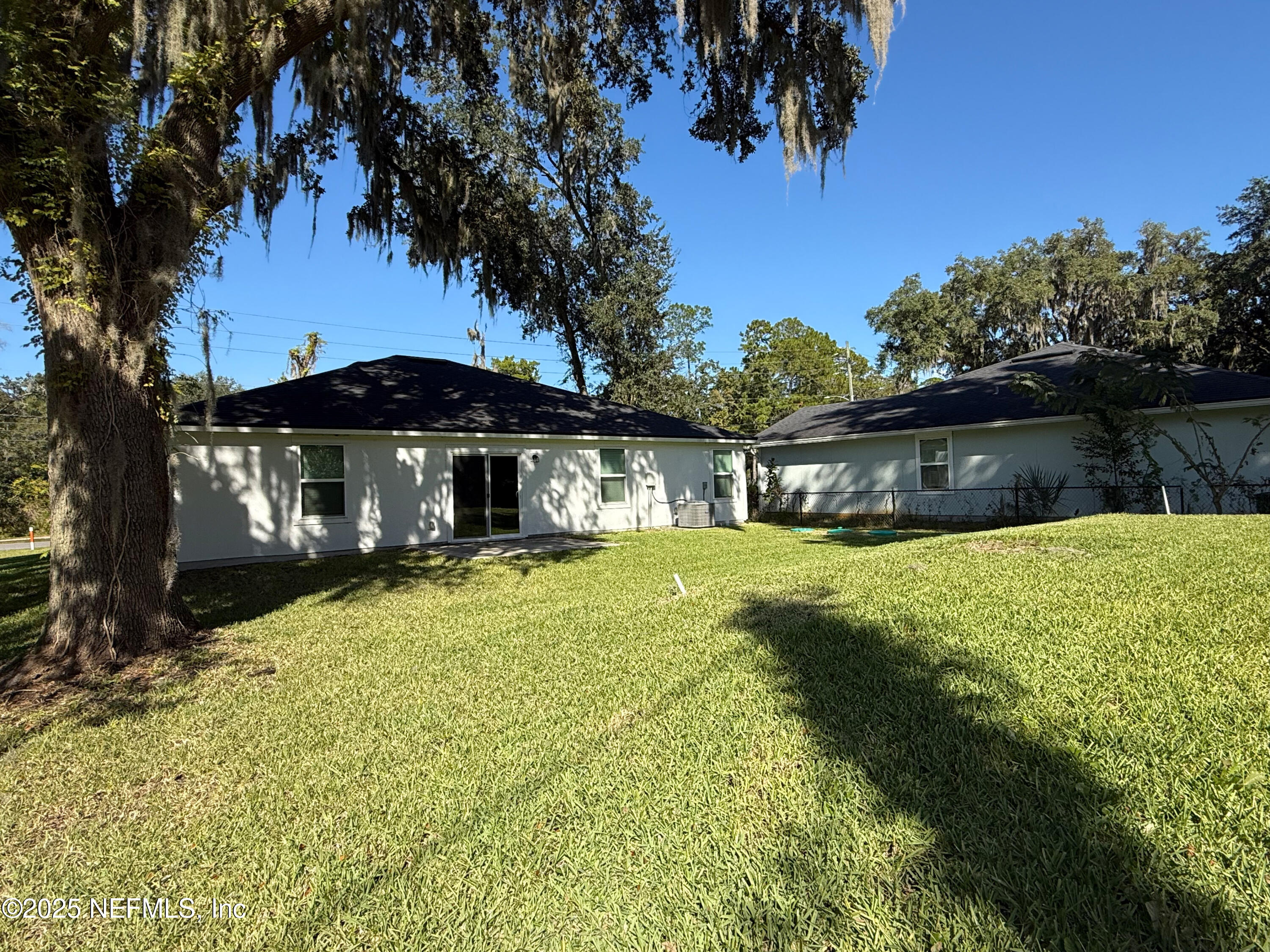 7426 Bowden Road Jacksonville, FL 32216 - Photo 22 of 23 a front view of a house with garden