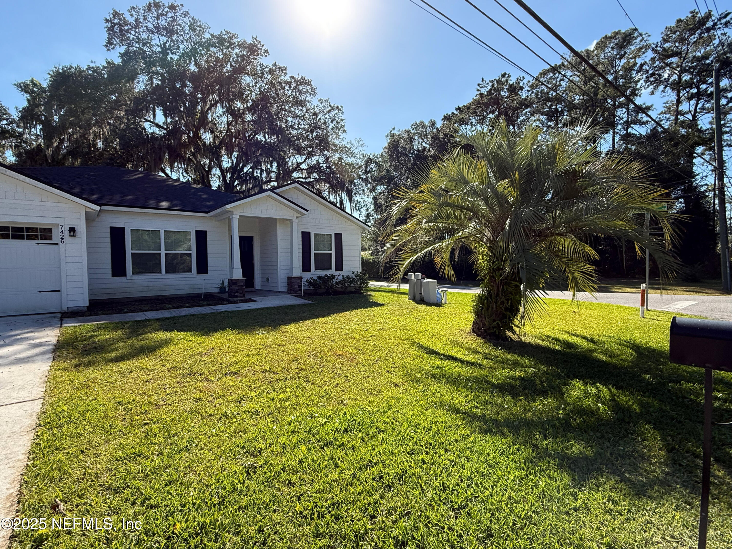 7426 Bowden Road Jacksonville, FL 32216 - Photo 23 of 23 a view of house with a yard