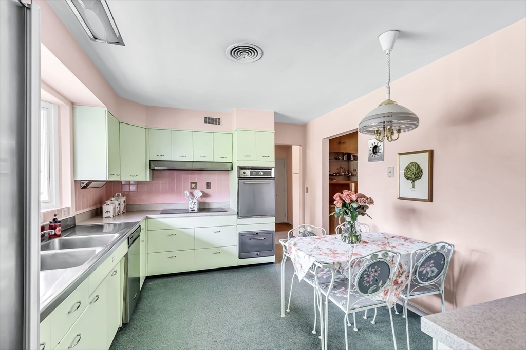 19 Steiger Road Holyoke, MA 01040 - Photo 13 of 22 a kitchen that has a lot of cabinets in it and wooden floors