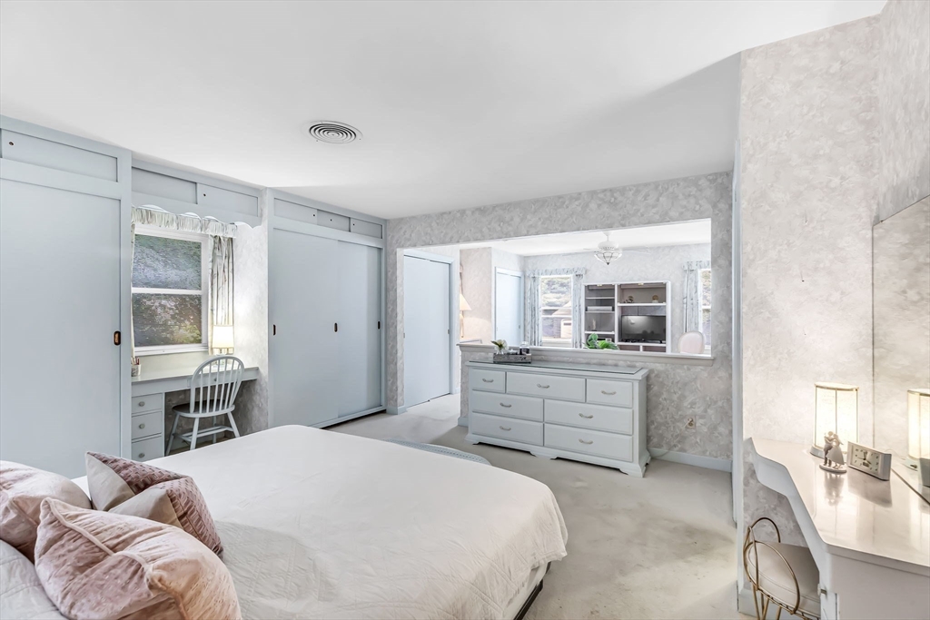 19 Steiger Road Holyoke, MA 01040 - Photo 16 of 22 a bedroom with a bed and a table