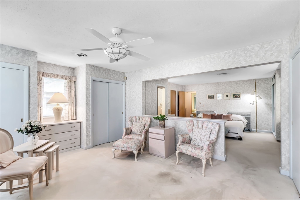19 Steiger Road Holyoke, MA 01040 - Photo 18 of 22 a living room with furniture and a chandelier