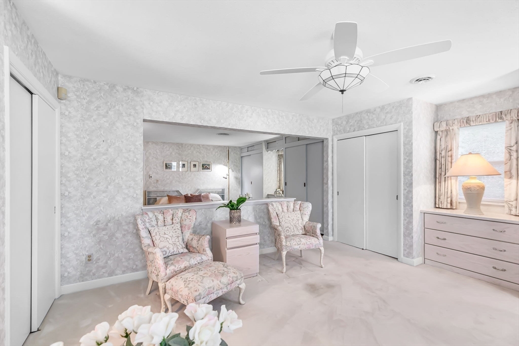 19 Steiger Road Holyoke, MA 01040 - Photo 19 of 22 a living room with furniture and a chandelier