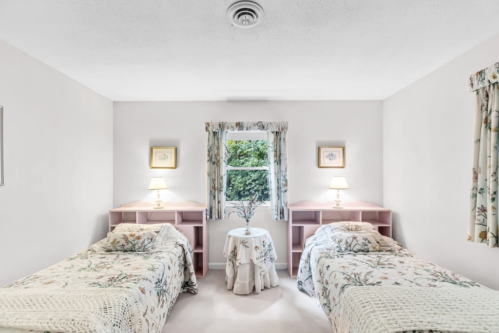 19 Steiger Road Holyoke, MA 01040 - Photo 20 of 22 a bedroom with two beds and a window