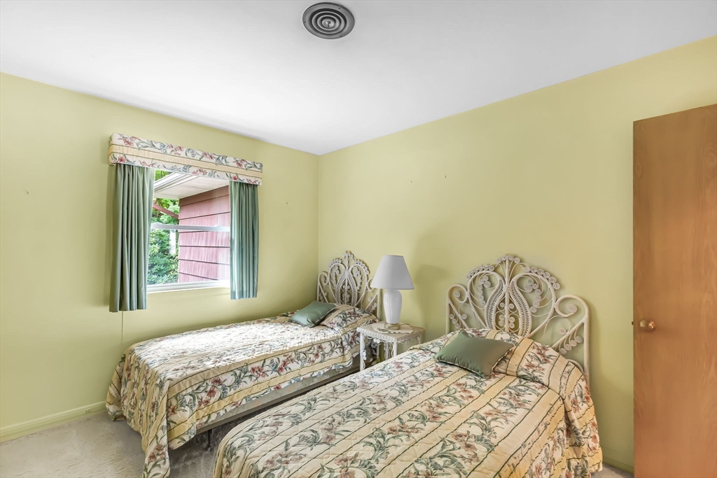 19 Steiger Road Holyoke, MA 01040 - Photo 21 of 22 a bedroom with double bed a couch and a window