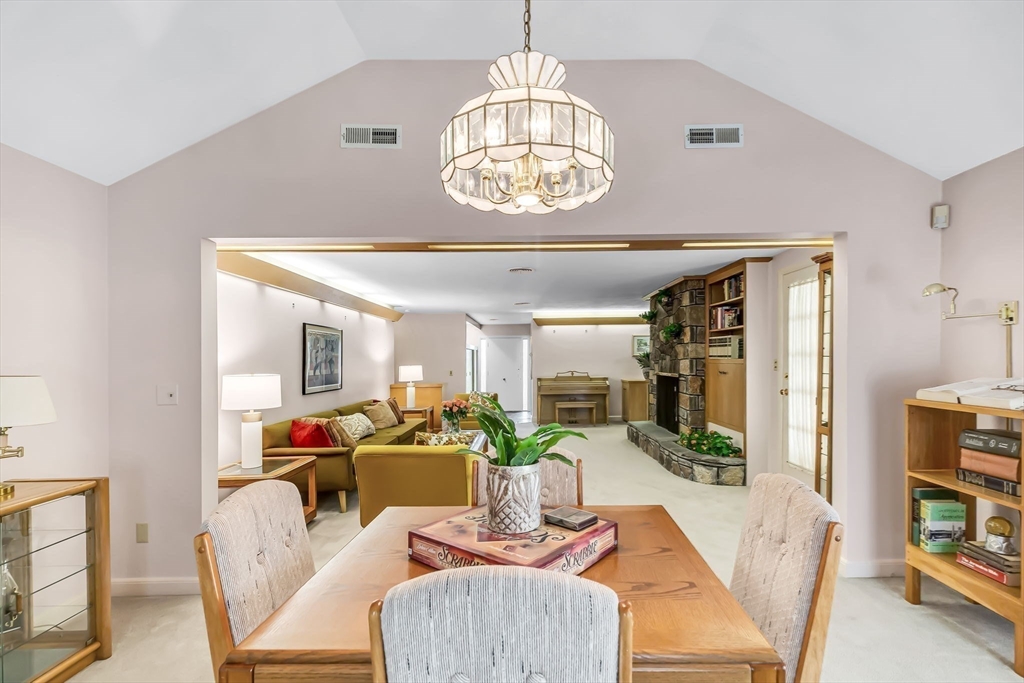 19 Steiger Road Holyoke, MA 01040 - Photo 7 of 22 a view of a dining room with furniture a chandelier and wooden floor