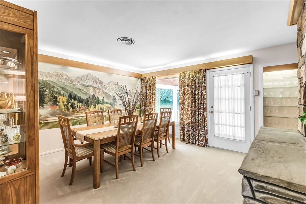 19 Steiger Road Holyoke, MA 01040 - Photo 10 of 22 a dining room with furniture and a floor to ceiling window
