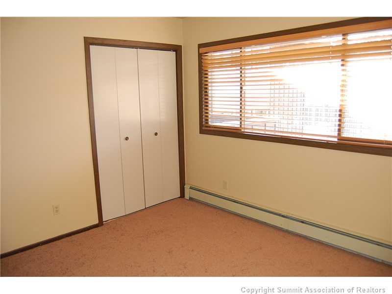 102 Salt Lick Circle, Unit 5 Silverthorne, CO 80498 - Photo 12 of 21 a view of an empty room with a window