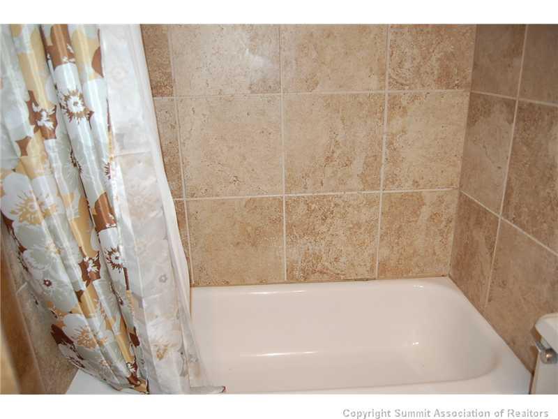 102 Salt Lick Circle, Unit 5 Silverthorne, CO 80498 - Photo 14 of 21 a bathroom with a shower
