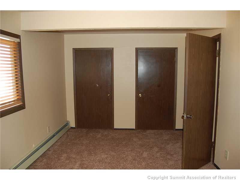 102 Salt Lick Circle, Unit 5 Silverthorne, CO 80498 - Photo 15 of 21 a view of an empty room with closet and a window