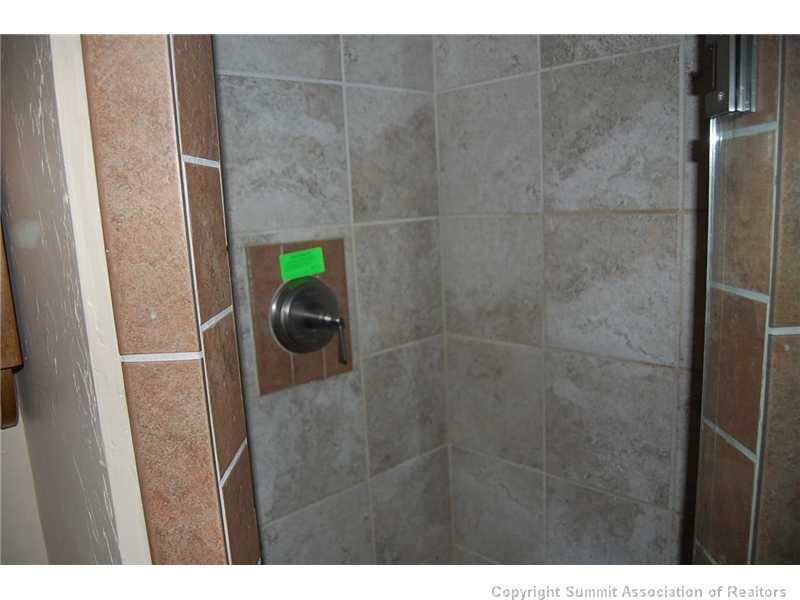 102 Salt Lick Circle, Unit 5 Silverthorne, CO 80498 - Photo 20 of 21 a bathroom with a sink and a mirror
