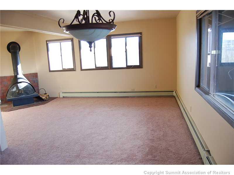 102 Salt Lick Circle, Unit 5 Silverthorne, CO 80498 - Photo 5 of 21 a view of an empty room and window