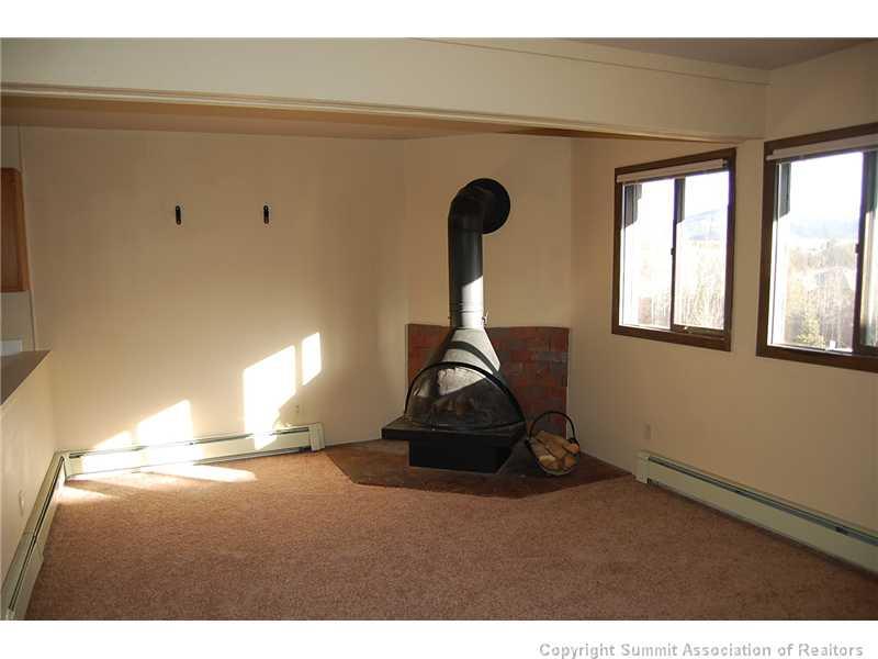 102 Salt Lick Circle, Unit 5 Silverthorne, CO 80498 - Photo 6 of 21 a room with gym equipment and a window