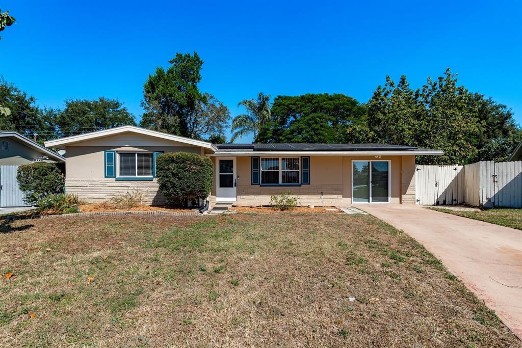 1748 Colmar Drive Holiday, FL 34690 - Photo 1 of 29 front view of a house with a yard