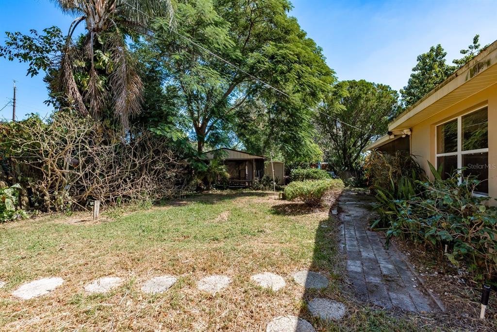 1748 Colmar Drive Holiday, FL 34690 - Photo 26 of 29 a view of a yard with plants and trees