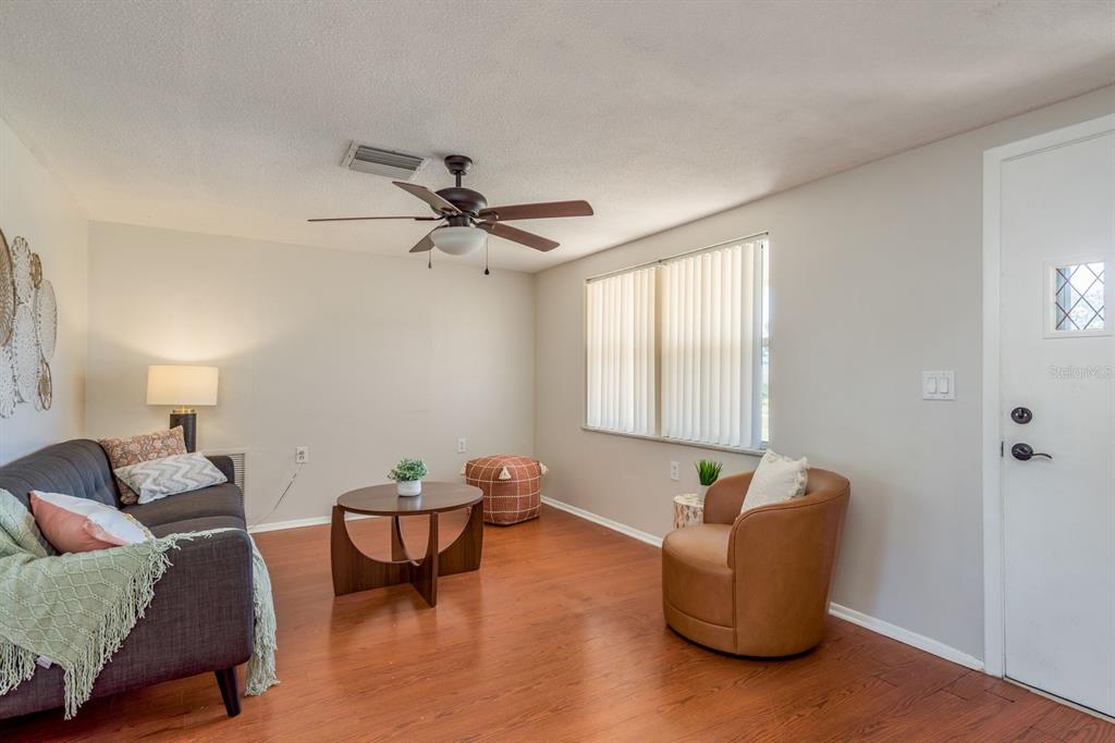 1748 Colmar Drive Holiday, FL 34690 - Photo 9 of 29 a living room with furniture and a window