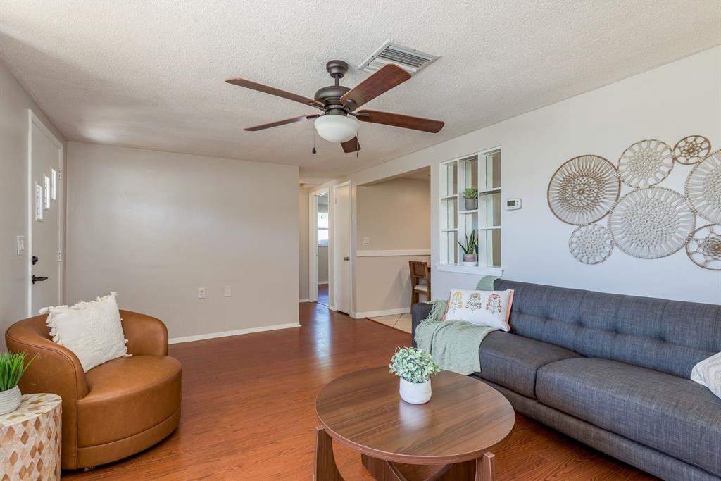 1748 Colmar Drive Holiday, FL 34690 - Photo 10 of 29 a living room with furniture and a large window