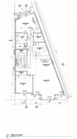 a black and white photo of a white building