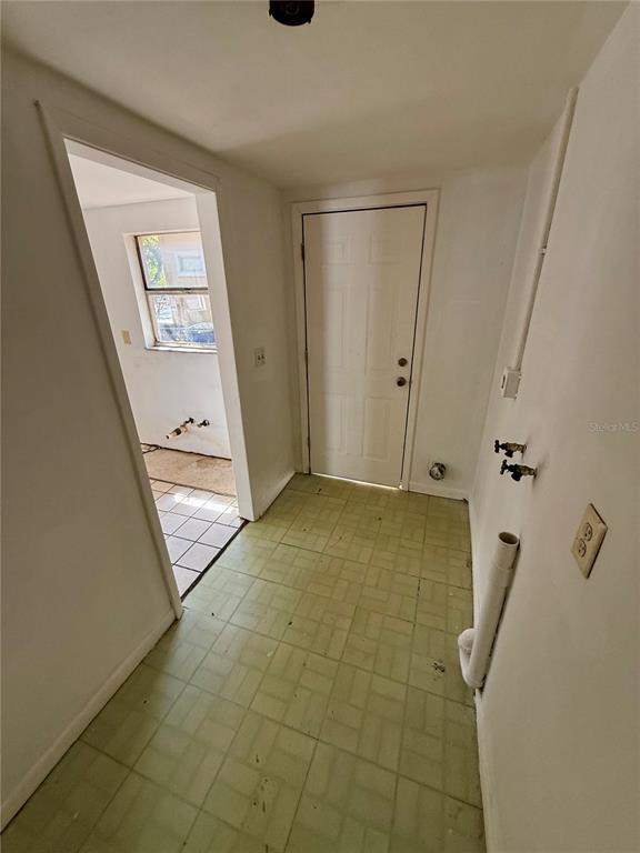 1134 Engman Street Clearwater, FL 33755 - Photo 11 of 27 a view of a hallway with a door