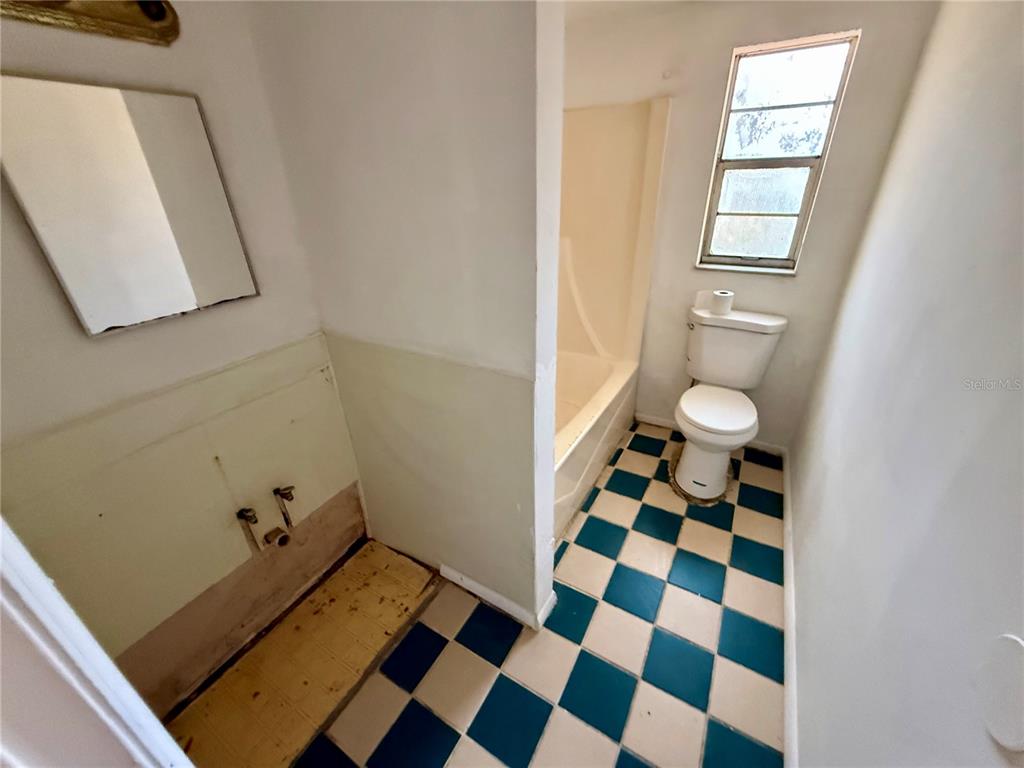 1134 Engman Street Clearwater, FL 33755 - Photo 14 of 27 a bathroom with a sink and a mirror