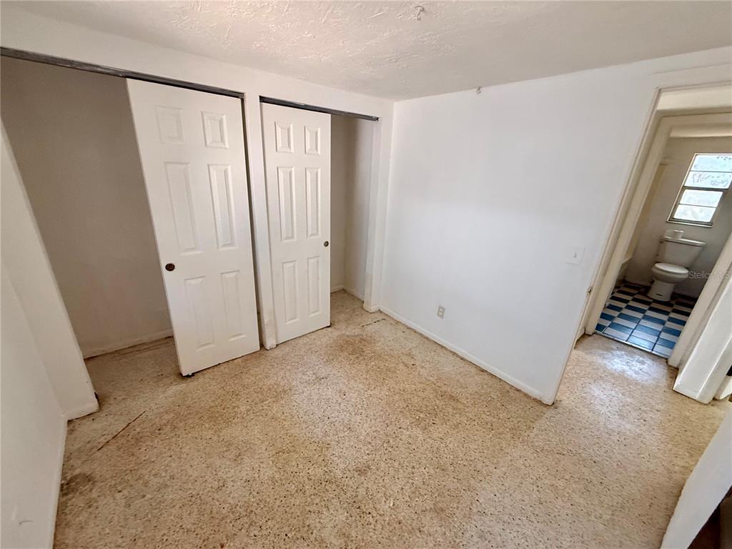 1134 Engman Street Clearwater, FL 33755 - Photo 17 of 27 an empty room with windows