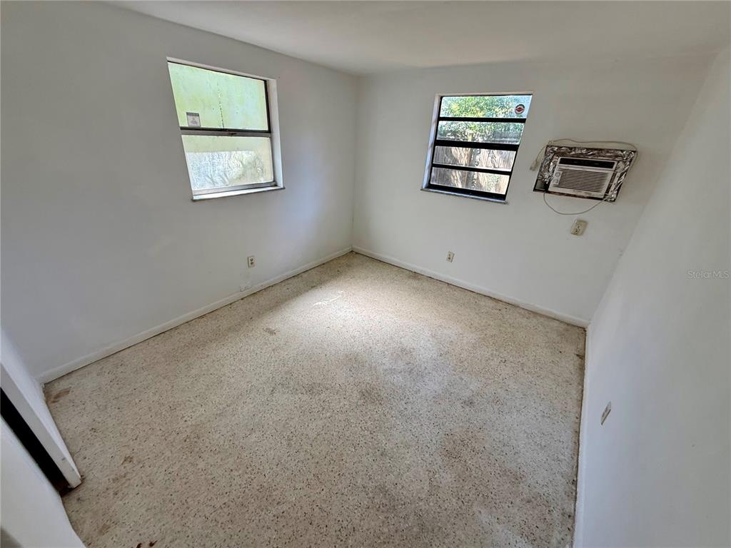 1134 Engman Street Clearwater, FL 33755 - Photo 18 of 27 an empty room with windows and closet